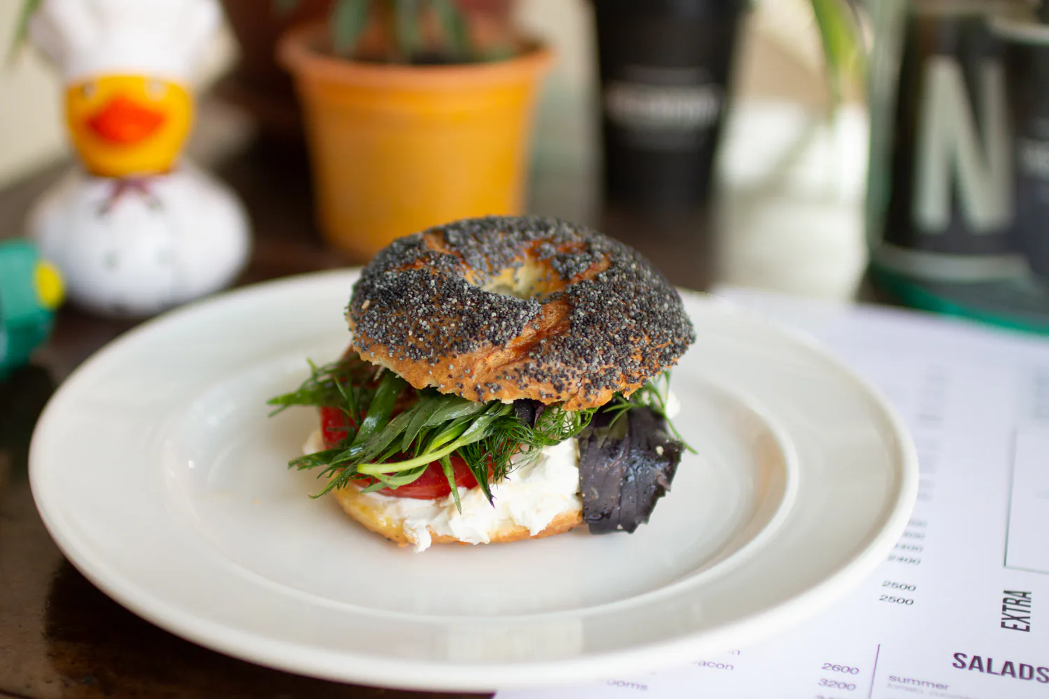 CEO's bagel with cream cheese, tomato, and fresh greens