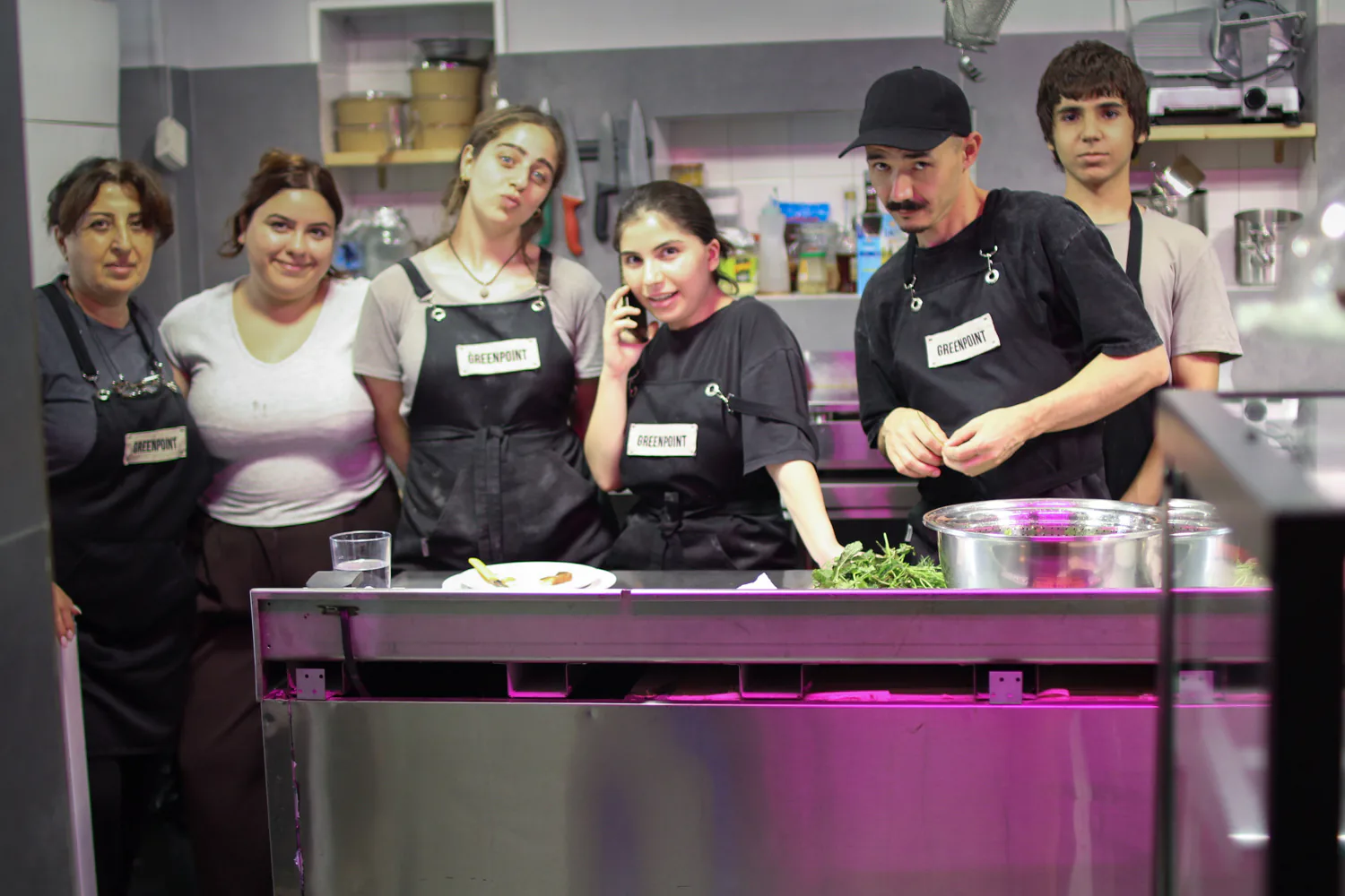 The Greenpoint team together behind the café counter