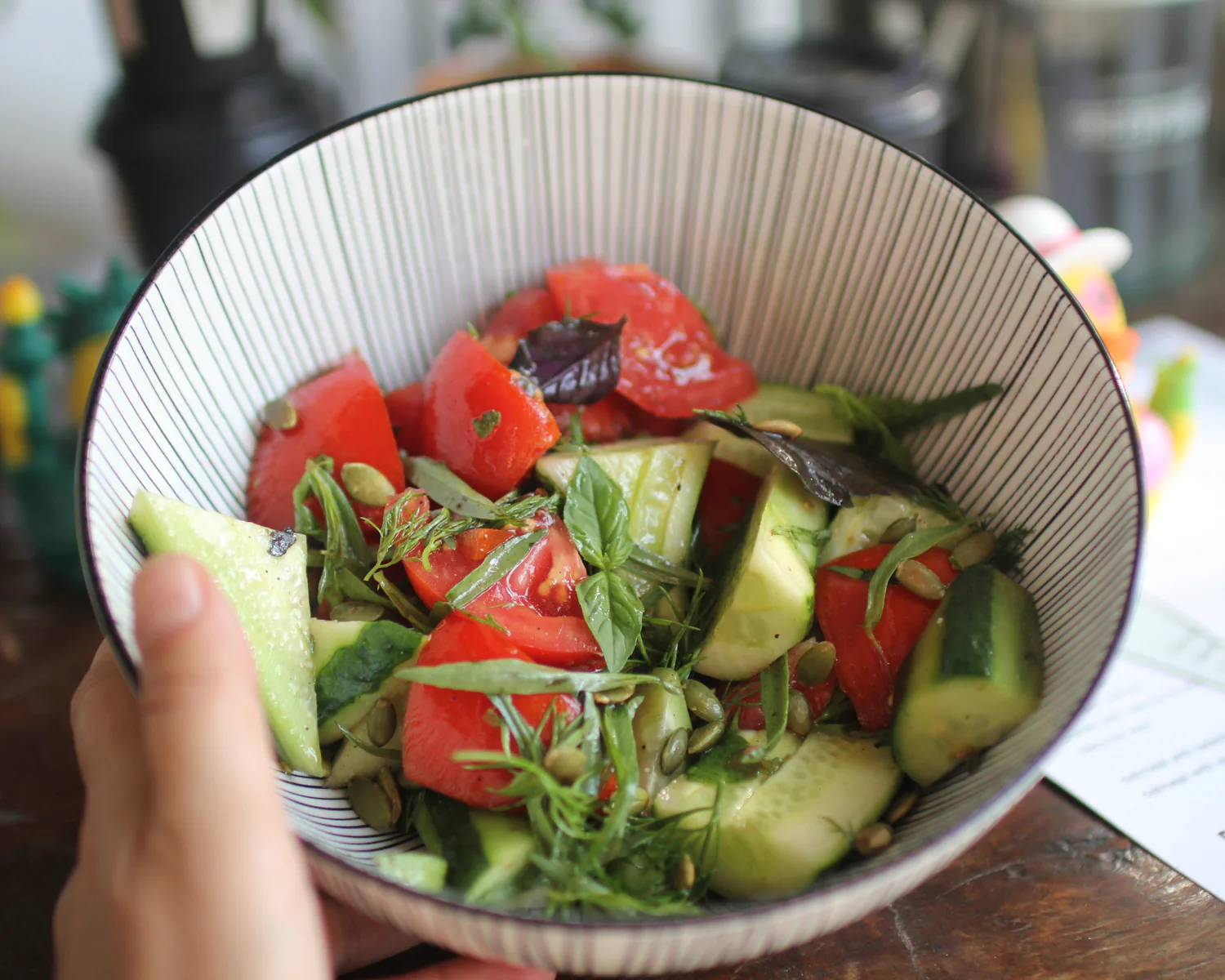 Summer salad with tomato, cucumber, and fresh greens