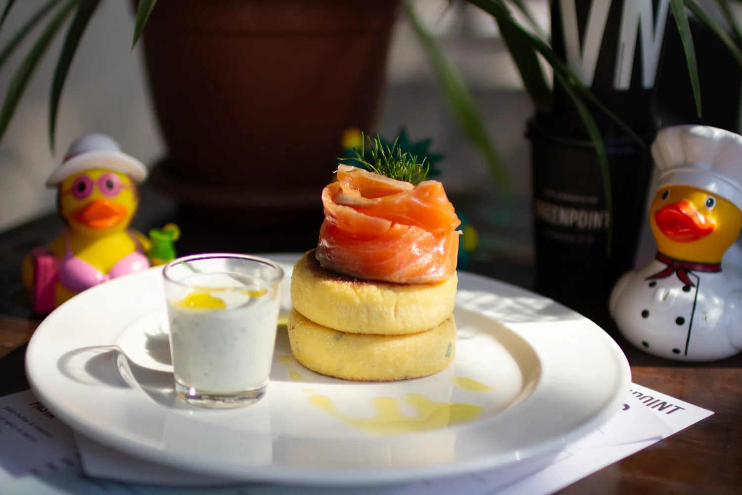 Syrniki with salmon, sour cream, and dill