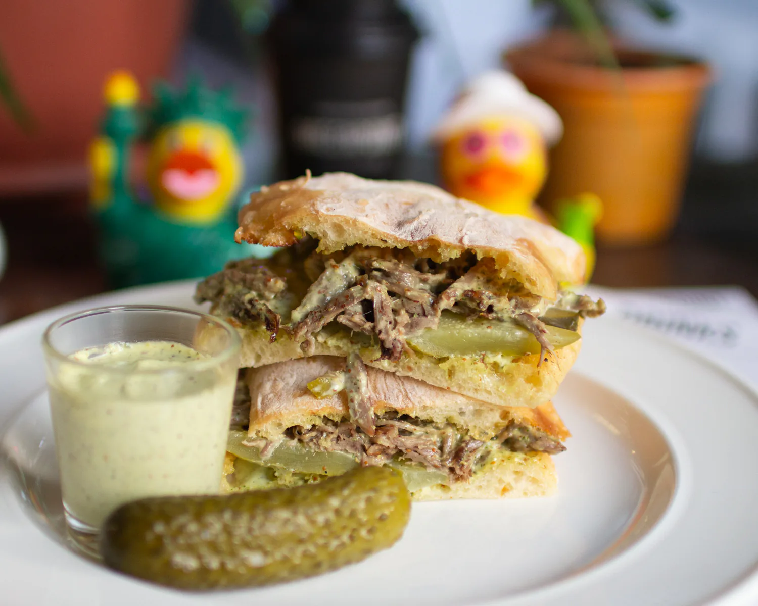 The Russian beef sandwich with garlic sauce and pickles
